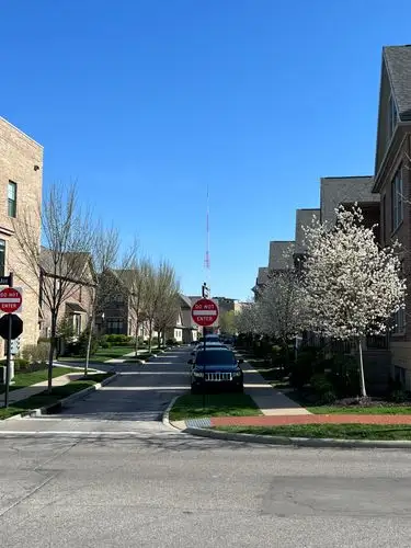 Quiet urban living under a vibrant blue sky.